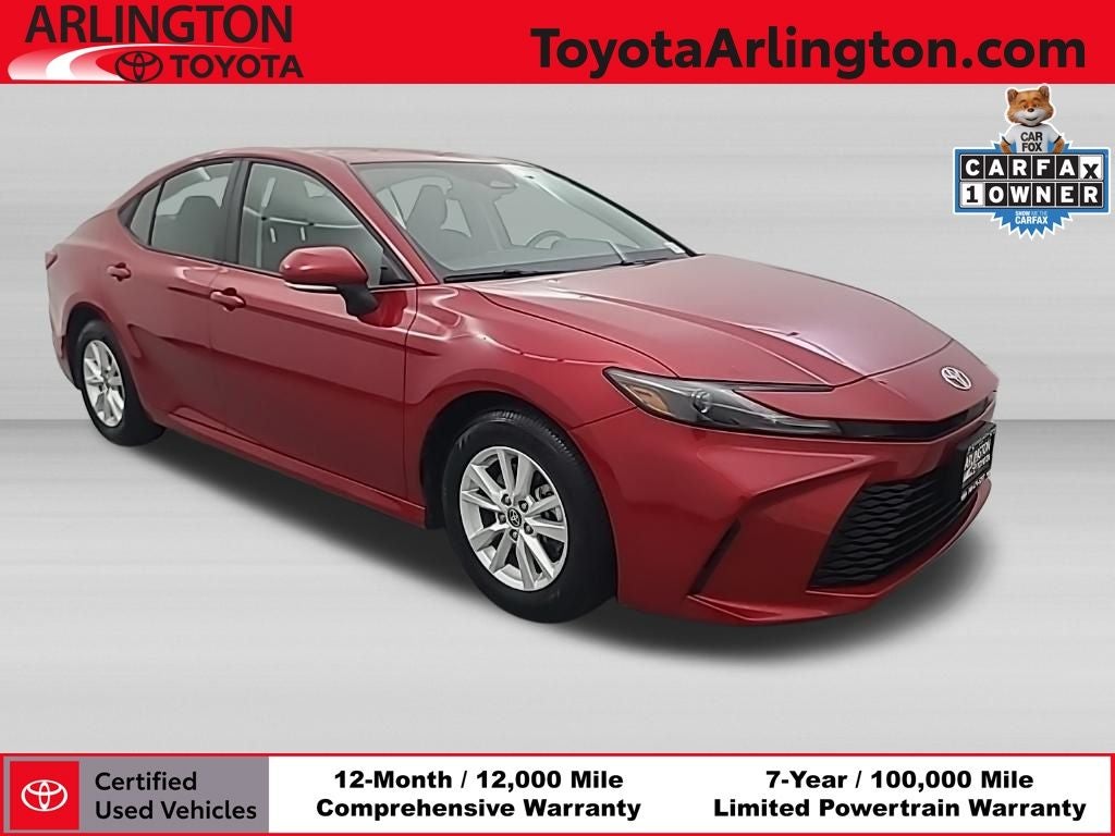 2026 Toyota Camry LE in Supersonic Red — front three-quarter view