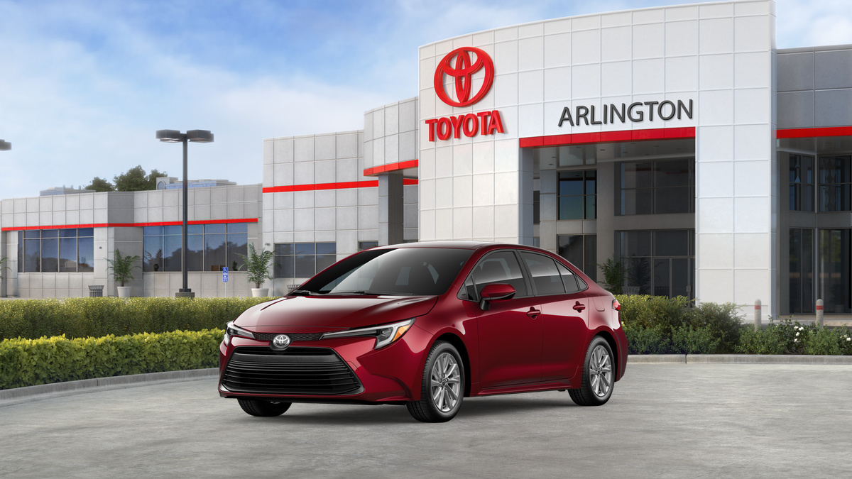 2026 Toyota Corolla Hybrid Hybrid LE in Ruby Flare Pearl — front three-quarter view